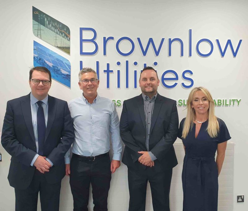 Conor stood with Brownlow Utilities staff in front of the company