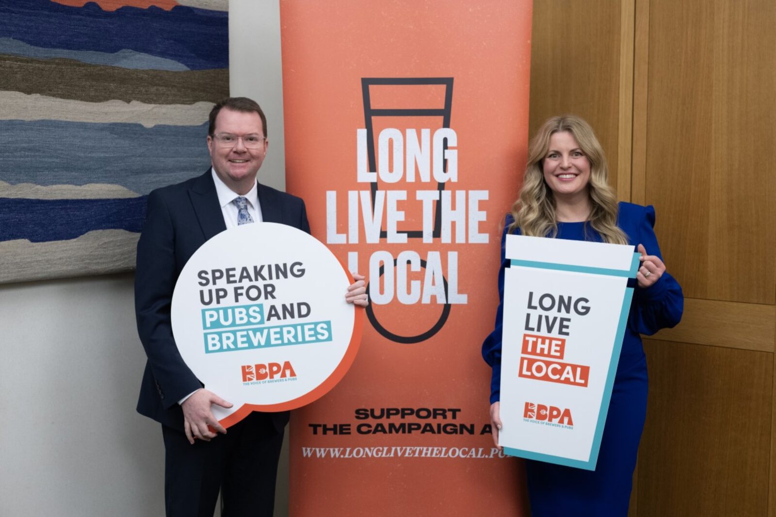 Conor Pictured with Long Live The Local Sign